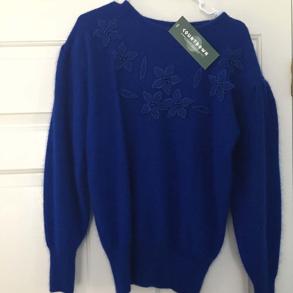 Blue, beaded, angora sweater small. Never worn.